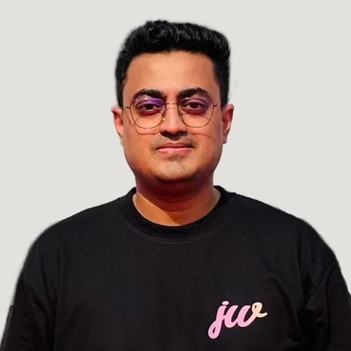 Man in black t-shirt with "jw" text.